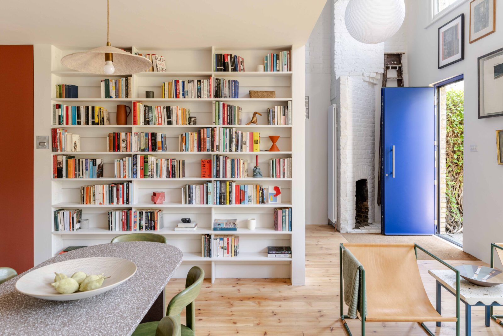 The big blue: a striking sculptural staircase forms the focus of this converted coach house in Camberwell